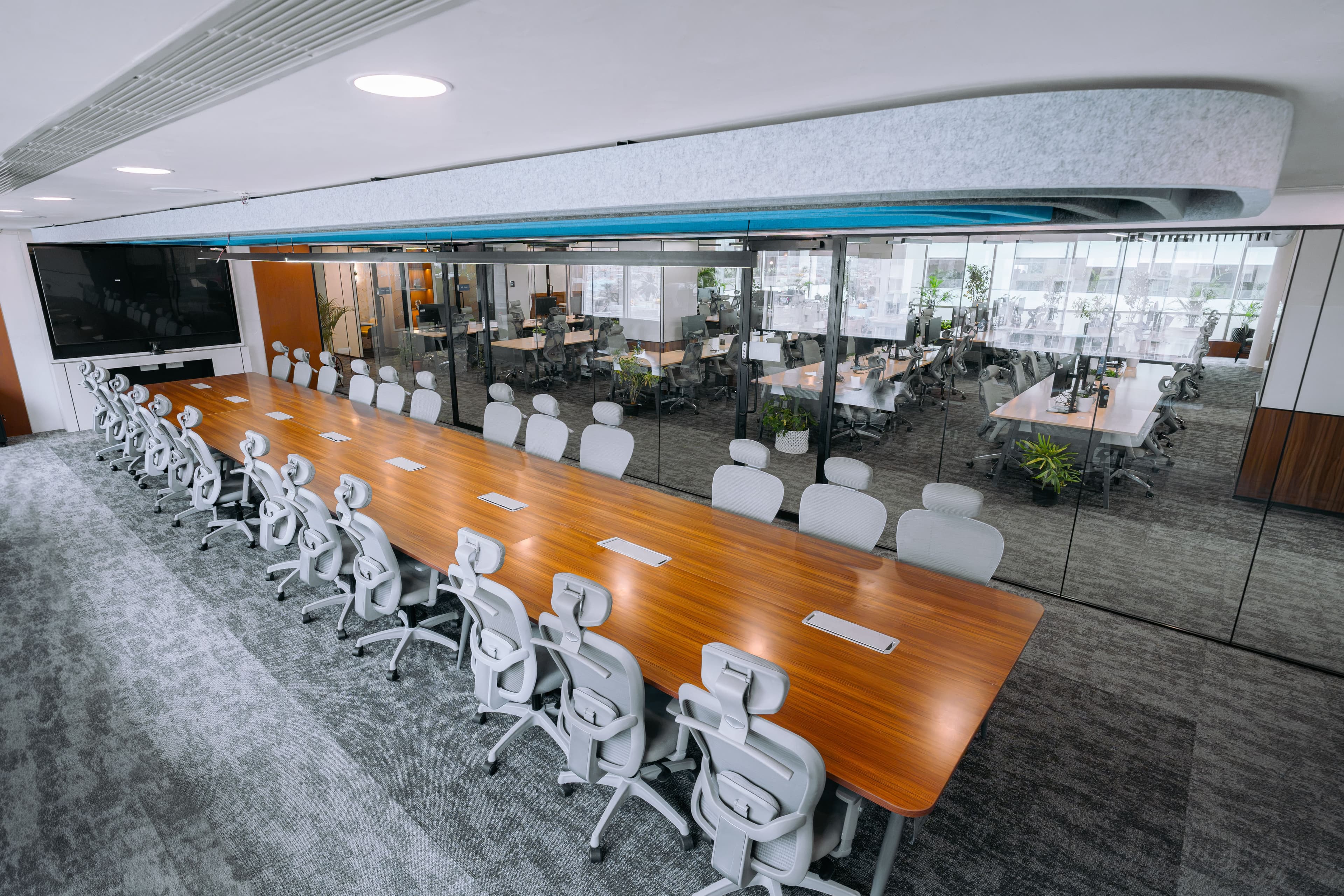Modern and fully equipped conference room with presentation screens at an Urban Vault workspace.