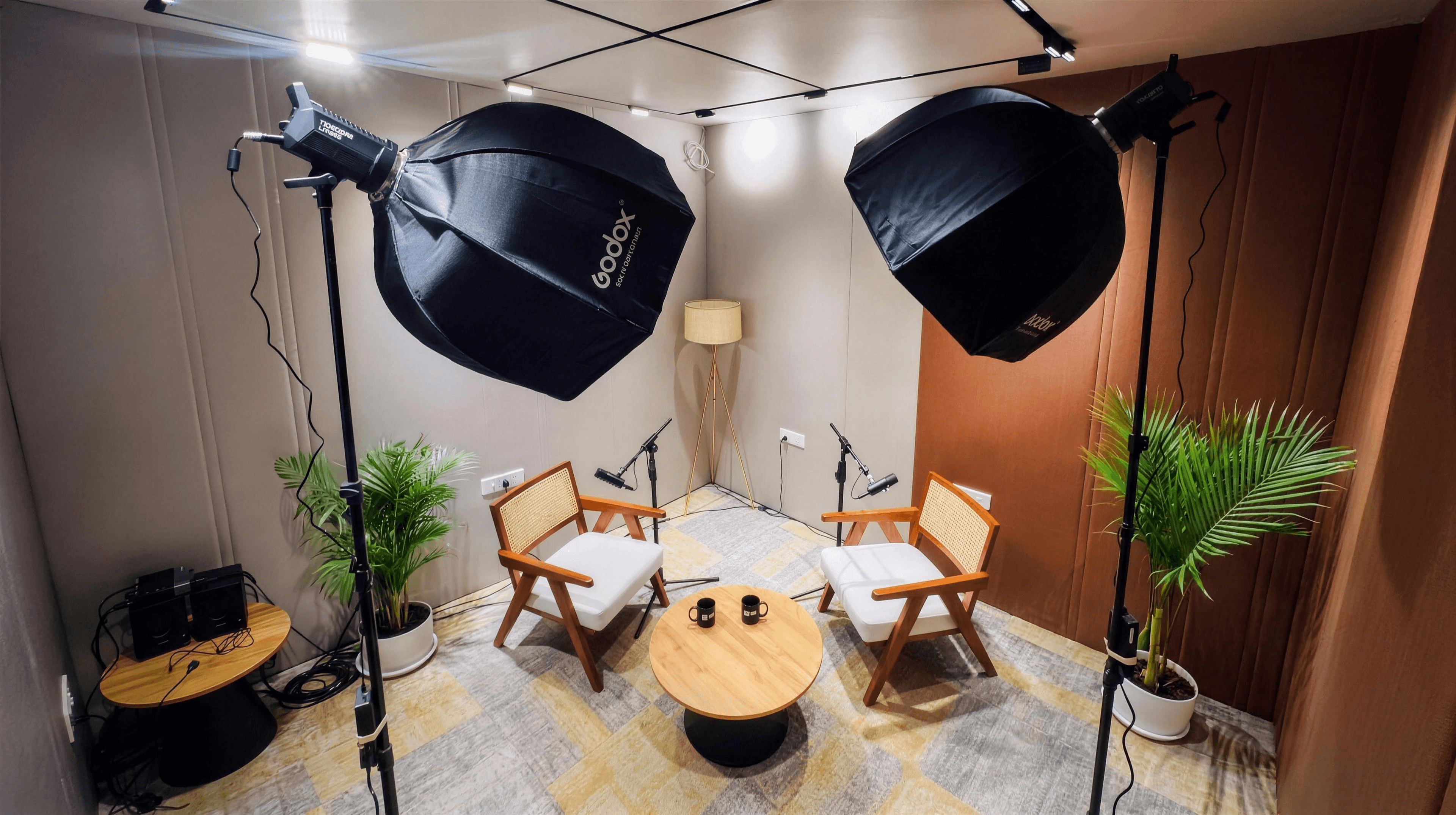 Acoustically treated professional podcast recording studio equipped with modern microphones at Urban Vault.