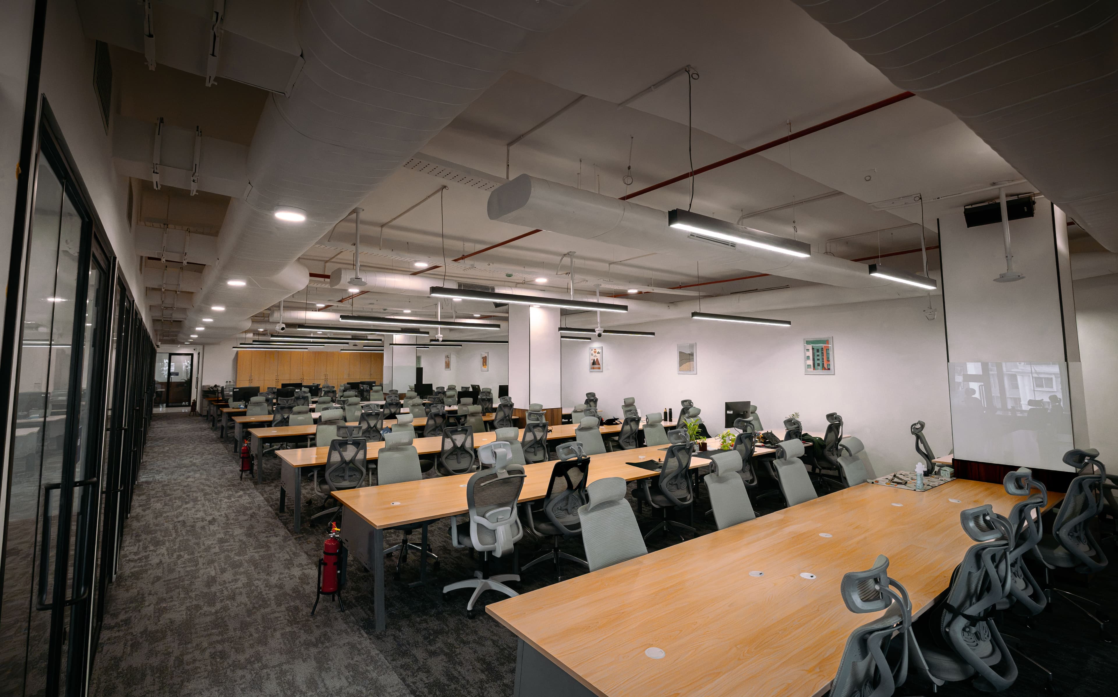 Hybrid semi-managed office workspace combining flexible leasing with essential infrastructure support.